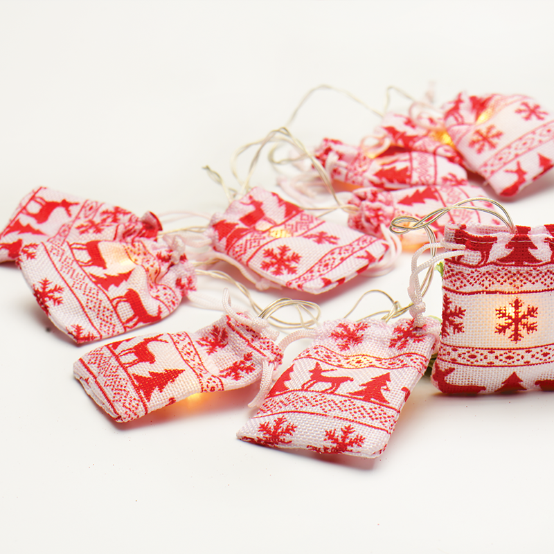 “WOVEN BAG STRING LIGHTS” WHITE   RED BAG 10 LED STRING LIGHTS WITH BATTERIES (2xΑΑ) WARM WHITE IP20 135+30cm TRANSPARENT CABLE XG10WW2A