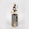 DECORATIVE SCULPTURE, RESIN, FEMALE WITH MUSICAL INSTRUMENT ΟΝ A BASE, WHITE-GOLD-BLACK,13x9.5x38cm 752-27050